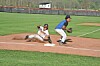 A player sliding into base in a baseball game.