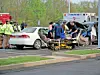 Emergency responders at a vehicle accident scene.