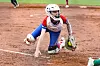 Softball player diving on the field.