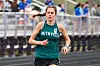 Runner in green Smithville jersey on track.