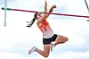 Athlete jumping over a pole vault bar.