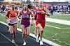 High school girls running in a track race.