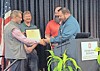 Award presentation at Ohio State University with participants at a podium.