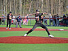 Baseball pitcher throwing a pitch on the field.