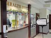 Health department reception area with a service counter and informational materials.