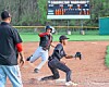 Baseball players in action at Carrollton Warriors field.