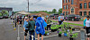 People browsing plants at a community plant sale.