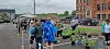 People browsing plants at a community plant sale.