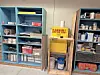 Shelves with supplies and a flammable materials sign in a storage area.