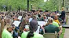 Musicians performing in a park setting.