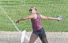 Athlete in action throwing a discus.