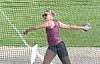 Athlete in action throwing a discus.