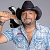 Musician with a guitar and cowboy hat