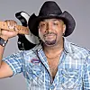 Musician with a guitar and cowboy hat