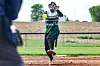 Softball player pitching on a field.