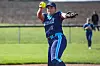 Softball player pitching on a field.