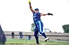 Softball pitcher throwing a ball on the field.
