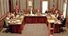 Local government officials seated at a meeting table.