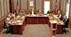Local government officials seated at a meeting table.