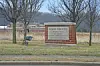 Knox County government office sign in a grassy area.