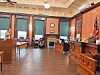 Courtroom with participants discussing legal matters.
