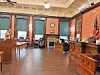 Courtroom with participants discussing legal matters.