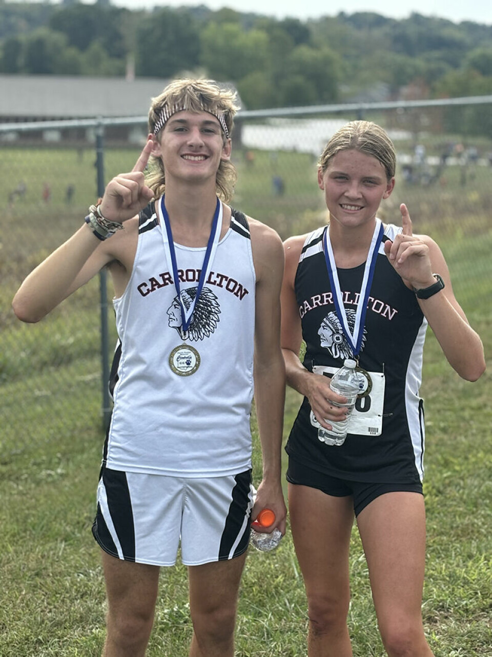 Race winners Ricky Sibila (left) and Kylie Ujcich.