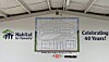 Habitat for Humanity banner with a floor plan and “Celebrating 40 Years!” text on an interior wall.