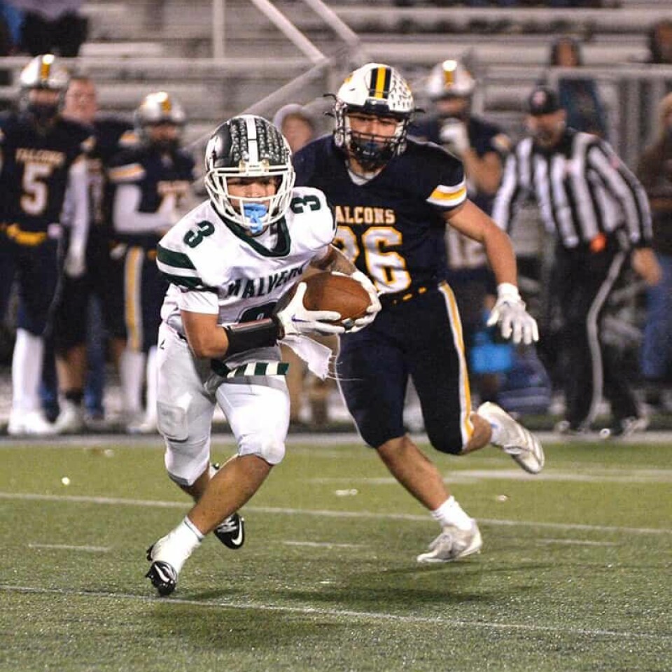 CCM/Carol McIntireRoy Simmons (3) crossed the field after catching a pass from quarterback Jared Witherow Friday with Hillsdale defender Owen Sloam (25) in pursuit.