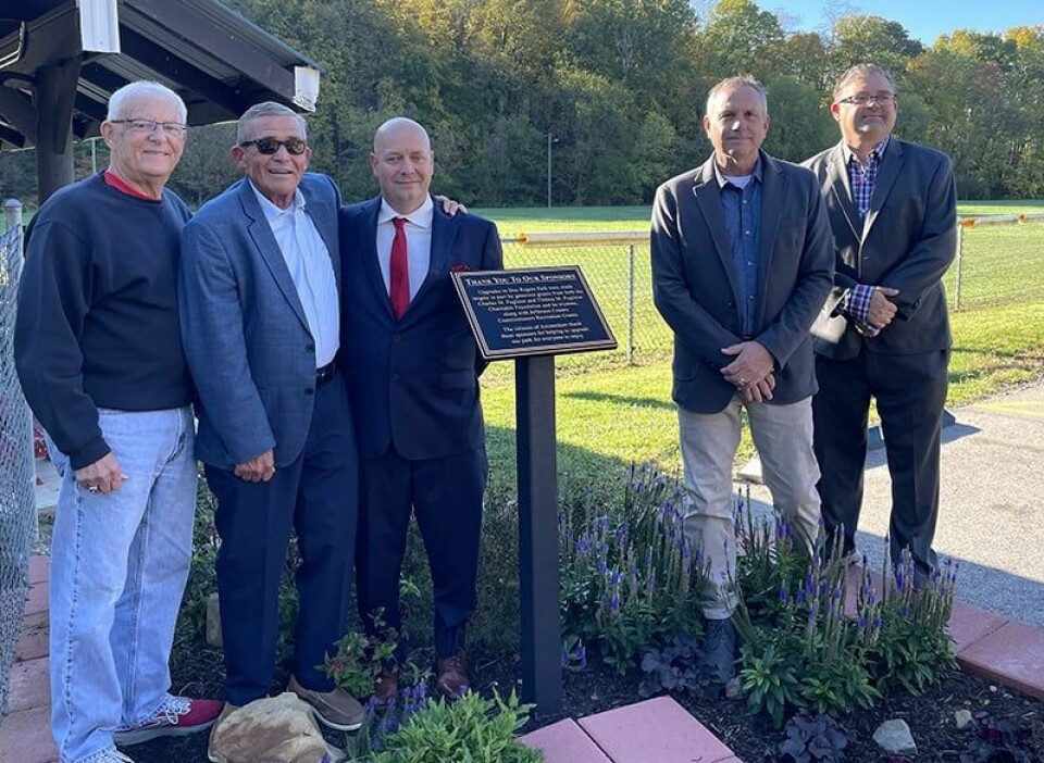 CCM/Carol McIntireThose taking part in a plaque dedication at Doc Rogers Park in Amsterdam Oct. 9 are shown above. From left are: Paul Timmons, trustee of the Charles M. Pugliese and Thelma M. Pugliese Foundation, Jefferson County Commissioner Tony Morelli, Amsterdam Mayor Jim Phillips and Commissioner Dave Maple and Commissioner Eric Timmons.