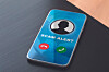 Smartphone on a table displaying a scam alert warning and call buttons.