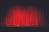 Abstract red vertical light streaks on a dark background.
