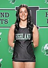 Young athlete in a black Highland jersey stands before a green school-logo backdrop.