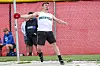 Athlete in a Smithville uniform throws an implement during a track and field competition.