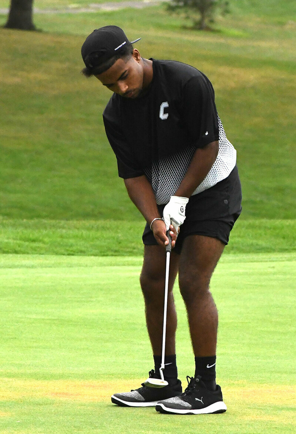 CCM/Dan RiesBryce Lonca sinks a putt in the opening season match against Alliance.