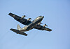 Pakistan Air Force C-130 transport aircraft in flight against a clear blue sky during Exercise Falcon Talon.