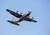 Pakistan Air Force C-130 transport aircraft in flight against a clear blue sky during Exercise Falcon Talon.