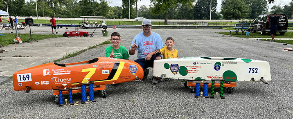 Submitted PhotoHudson (left) and Jensen (right) Stull along with their father, Brian Stull (center) celebrate after a race. Brian was a Soap Box Derby racer in his youth and is the current board resident for Tuscarawas County organization.