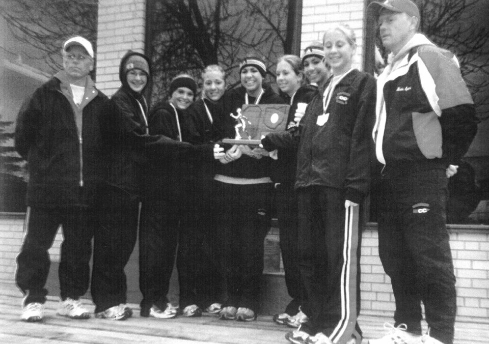 Members of the 2001 Carrollton High School Girls Cross Team who raced in the Division II Regional championship are shown above. From left are Assistant Coach Mark Spears, Lindsay Lucas, Danielle Castellucci, Karan McCaulley, Emily Wood, Lisa McCaulley, Abby Wood, Chalynne McCaulley and Head Coach Kevin Spears.