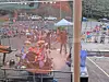 View from the stage toward a crowd gathered outdoors at a concert venue.