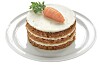 Layered carrot cake with white frosting, carrot garnish and mint on a glass plate.