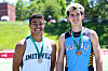 Two male athletes in Smithville and Hilldale uniforms stand outdoors on a sunny day.