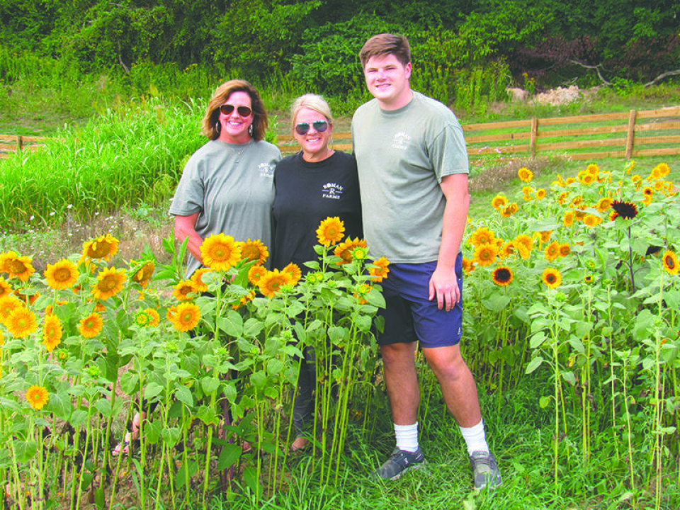 CCM/Thomas ClapperThe crew at Roman R. Farms strives to bring together flowers and nature in a relaxing atmosphere and allow visitors to take a bit of that beauty home with them.The crew of the Sherrodsville area business is shown above. From left are employee Julie Shepard and co-owners Jill and Carter Zimmerman. Co-owner Brian Zimmerman is not pictured.