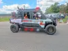 A Marlboro Fire Company rescue vehicle with lights on is parked on a road near a crowd and other vehicles.