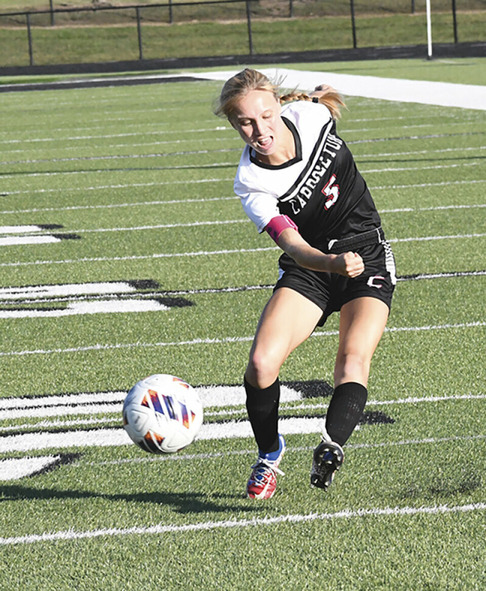CCM/Carol McIntireCarrollton junior Isabella Nuzzolillo sends a shot toward Marlington last week at Community Field.