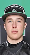 Close-up portrait of a baseball player wearing a cap and sunglasses on the brim.