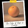 A Polaroid-style image of an orange with handwritten text below it.