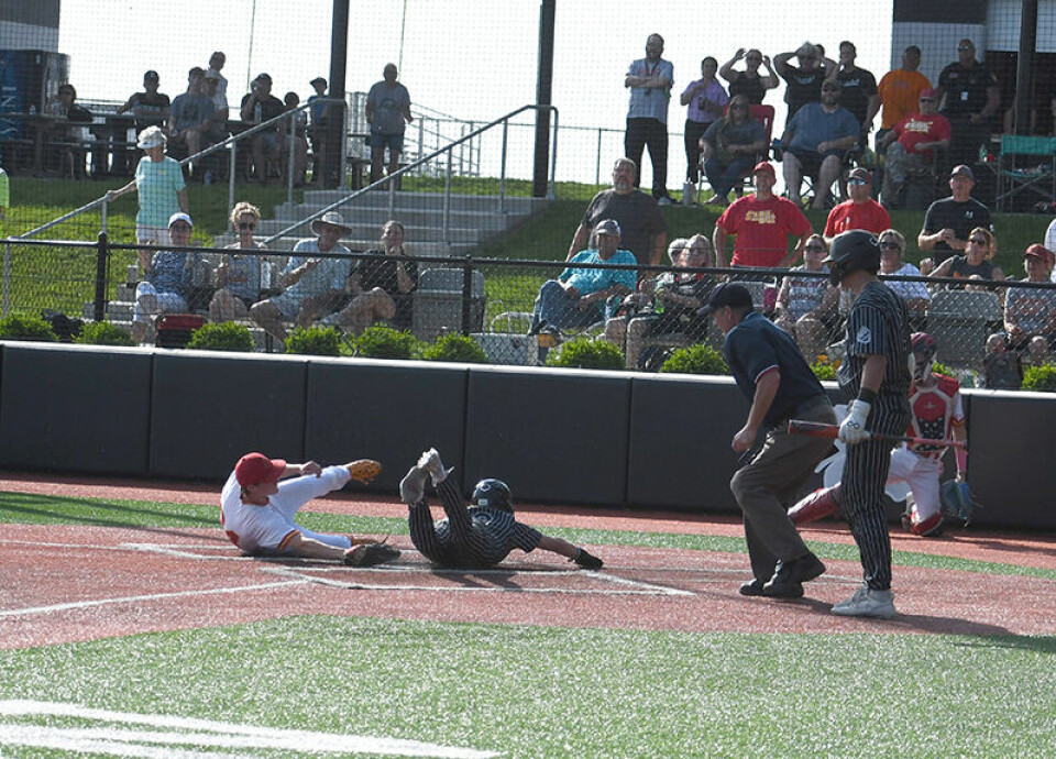 CCM/Dan RiesCarrollton junior Garrett Broadwater races home on a wild pitch to put the Warriors ahead 2-1 in the third inning of first round district play against Indian Creek.