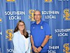 Two people standing side by side in front of a blue Southern Local backdrop with repeated logos.
