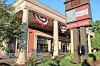 Exterior of a brick building with columns, patriotic bunting, and a sign listing David Ohio and Muncipal Building.
